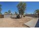 Fenced backyard with shade tree and desert landscaping provides ample space at 1708 W Estrella Dr, Chandler, AZ 85224