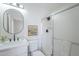 Bathroom featuring a modern vanity, oval mirror, and shower with glass door at 1708 W Estrella Dr, Chandler, AZ 85224