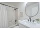 Bathroom featuring modern fixtures, a shower, and a decorative mirror at 1708 W Estrella Dr, Chandler, AZ 85224