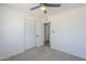 Bedroom including a ceiling fan, carpet, and a closet at 1708 W Estrella Dr, Chandler, AZ 85224