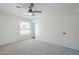 Carpeted bedroom with a ceiling fan and a view outside the window at 1708 W Estrella Dr, Chandler, AZ 85224