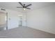 Carpeted bedroom providing access to a walk-in closet at 1708 W Estrella Dr, Chandler, AZ 85224