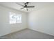 Bedroom with natural light, ceiling fan, and neutral carpet at 1708 W Estrella Dr, Chandler, AZ 85224