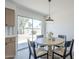 Bright dining area featuring a round table, chairs, and sliding glass doors to a patio at 1708 W Estrella Dr, Chandler, AZ 85224