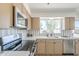 Bright kitchen area with stainless steel appliances and white countertops at 1708 W Estrella Dr, Chandler, AZ 85224