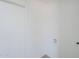 A bright laundry room featuring a utility sink and washer/dryer hookups at 1708 W Estrella Dr, Chandler, AZ 85224