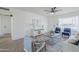 Cozy living room with stylish decor, modern ceiling fan, and view of dining area at 1708 W Estrella Dr, Chandler, AZ 85224