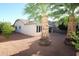 Desert landscaped backyard with palm trees at 17516 W Pershing St, Surprise, AZ 85388