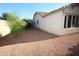 Low maintenance backyard with desert landscaping and privacy at 17516 W Pershing St, Surprise, AZ 85388