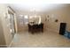 Inviting dining room featuring a decorative chandelier, tiled floors, and sliding door access to the outdoor area at 17516 W Pershing St, Surprise, AZ 85388