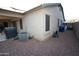 View of the property exterior with an air conditioning unit at 17516 W Pershing St, Surprise, AZ 85388