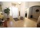 Welcoming foyer area with natural light, neutral color scheme, and access to other parts of the house at 17516 W Pershing St, Surprise, AZ 85388
