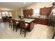 Modern kitchen with island seating, sleek appliances, and ample counter space for cooking and entertaining at 17516 W Pershing St, Surprise, AZ 85388