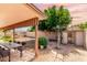 Beautifully landscaped backyard with outdoor dining area and a lush lawn perfect for relaxation at 18814 N 33Rd Ave, Phoenix, AZ 85027