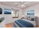 Cozy bedroom features a plush bed, window, and artwork at 18814 N 33Rd Ave, Phoenix, AZ 85027