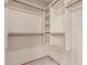 Walk-in closet with built-in shelves and clothing racks at 18814 N 33Rd Ave, Phoenix, AZ 85027