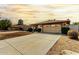 Charming single-story home showcasing a well-maintained front yard and two car garage at 18814 N 33Rd Ave, Phoenix, AZ 85027
