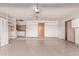 Spacious garage featuring a clean epoxy floor, shelving, and an exterior door for easy access at 18814 N 33Rd Ave, Phoenix, AZ 85027