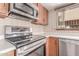Cozy kitchen with stainless steel appliances and plentiful counter space at 18814 N 33Rd Ave, Phoenix, AZ 85027