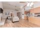Open living space showcases a fireplace, neutral furnishings, and pass-through to kitchen at 18814 N 33Rd Ave, Phoenix, AZ 85027