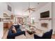 Comfortable living room features vaulted ceilings, fireplace and an open floor plan with updated flooring at 18814 N 33Rd Ave, Phoenix, AZ 85027