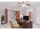 Functional office space features wooden desk, ceiling fan, and neutral paint at 18814 N 33Rd Ave, Phoenix, AZ 85027