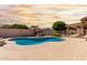 Inviting in-ground pool with a spacious patio area, perfect for lounging and outdoor activities at 18814 N 33Rd Ave, Phoenix, AZ 85027