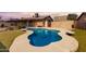 Backyard pool featuring cool, clear blue water, a concrete deck, and lush landscaping offering a private oasis at 18814 N 33Rd Ave, Phoenix, AZ 85027