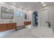Luxurious bathroom with a freestanding tub, double vanities, and elegant marble tile at 19829 N 97Th St, Scottsdale, AZ 85255