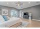 Serene bedroom featuring soft colors, plush bedding, and an arched doorway leading to an additional space at 19829 N 97Th St, Scottsdale, AZ 85255