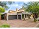 Charming home with desert landscaping, a two car garage and inviting curb appeal at 19829 N 97Th St, Scottsdale, AZ 85255