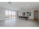 Bright game room featuring a pool table and large windows with scenic views at 19829 N 97Th St, Scottsdale, AZ 85255
