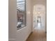Bright hallway with hardwood floors, arched doorways, and modern lighting fixtures at 19829 N 97Th St, Scottsdale, AZ 85255