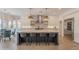 Gourmet kitchen featuring stainless steel appliances, a large island, and white cabinetry, perfect for culinary enthusiasts at 19829 N 97Th St, Scottsdale, AZ 85255
