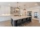 Kitchen featuring a large center island, stainless steel appliances, and modern pendant lighting at 19829 N 97Th St, Scottsdale, AZ 85255