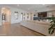 Spacious living room with hardwood floors, a large comfortable couch, and abundant natural light at 19829 N 97Th St, Scottsdale, AZ 85255