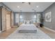 Spacious bedroom featuring stylish pendant lights, barn door entry, and a soothing color palette at 19829 N 97Th St, Scottsdale, AZ 85255