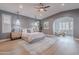 Bright bedroom boasts a calming ambiance, with an inviting view of the connected sitting room at 19829 N 97Th St, Scottsdale, AZ 85255