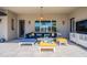 Covered patio with comfortable sectional seating and scenic backyard views at 19829 N 97Th St, Scottsdale, AZ 85255