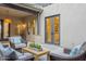 Cozy covered patio with comfortable seating, a coffee table, and serene outdoor ambiance at 19829 N 97Th St, Scottsdale, AZ 85255