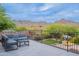 Panoramic views from this stunning patio with stylish seating, desert landscape, and mountain vistas at 19829 N 97Th St, Scottsdale, AZ 85255