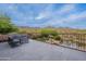 Spacious outdoor patio offering mountain views and cozy seating areas with desert landscaping at 19829 N 97Th St, Scottsdale, AZ 85255