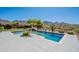 Stunning pool area with mountain views, comfortable seating, and lush desert landscaping at 19829 N 97Th St, Scottsdale, AZ 85255