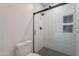 Modern shower featuring white subway tile, black hardware, and honeycomb tile shower floor at 19829 N 97Th St, Scottsdale, AZ 85255