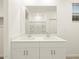Bathroom featuring double sinks, modern fixtures, and sleek design, offering a spa-like experience at 20795 N Roadrunner Ln, Maricopa, AZ 85138