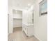 Modern bathroom with double vanity, walk-in closet and tile flooring that enhance the appeal of the home at 20795 N Roadrunner Ln, Maricopa, AZ 85138