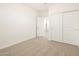 Bedroom with plush carpet, white trim, and closet with sliding doors at 20795 N Roadrunner Ln, Maricopa, AZ 85138