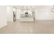 Open-concept area displaying a kitchen island, stainless steel appliances, and stylish pendant lighting at 20795 N Roadrunner Ln, Maricopa, AZ 85138