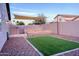 Backyard has artificial grass, brick pavers and a shade covering at 22755 W Yavapai St, Buckeye, AZ 85326