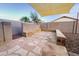 Backyard has artificial grass and stone landscaping at 22755 W Yavapai St, Buckeye, AZ 85326